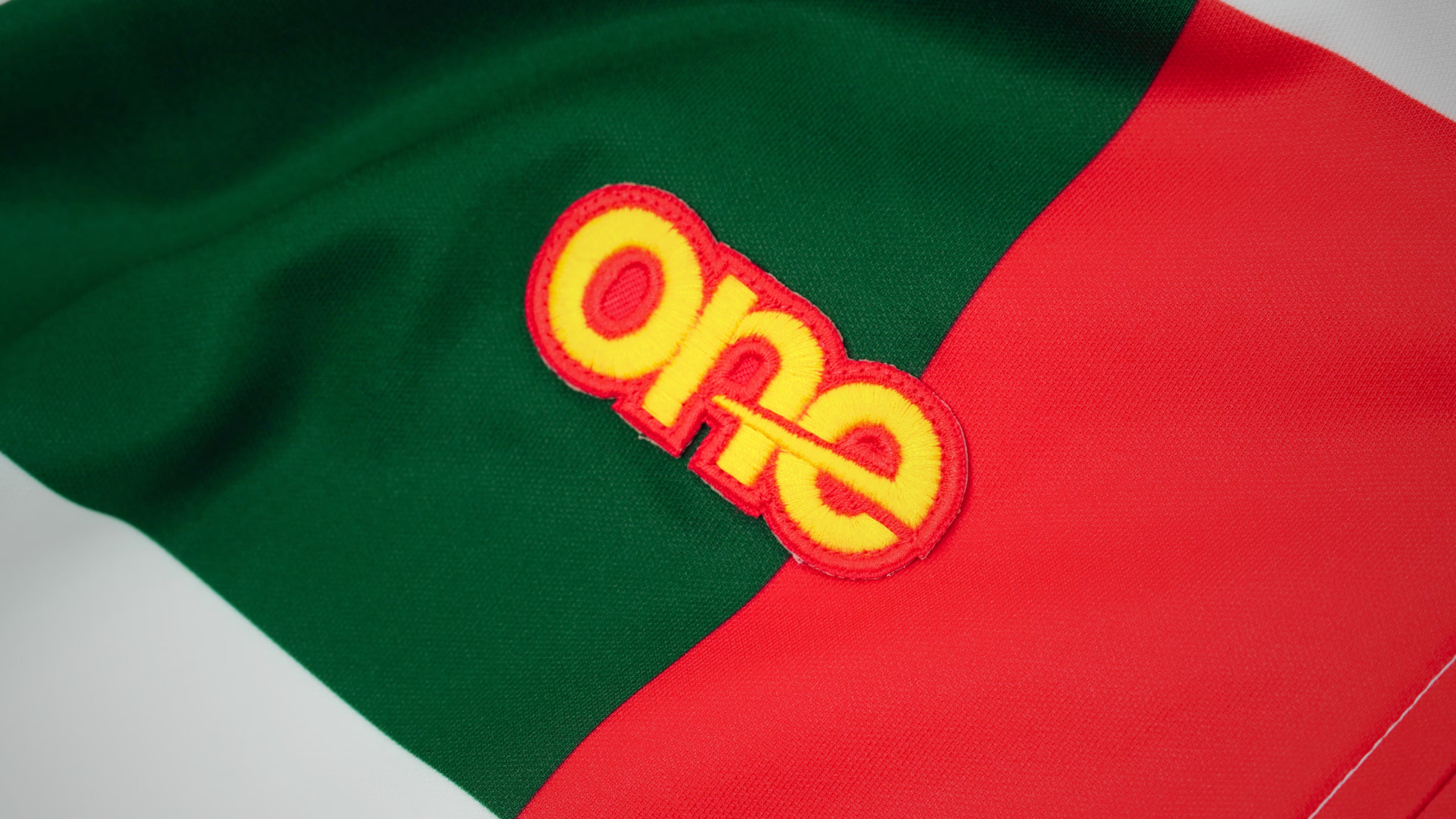 Official Oneallsports football shirt worn on the pitch, featuring NFC-enabled technology and sustainable design
